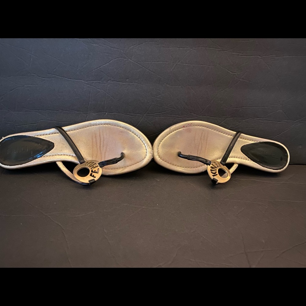 Fendi sandals in gold and black